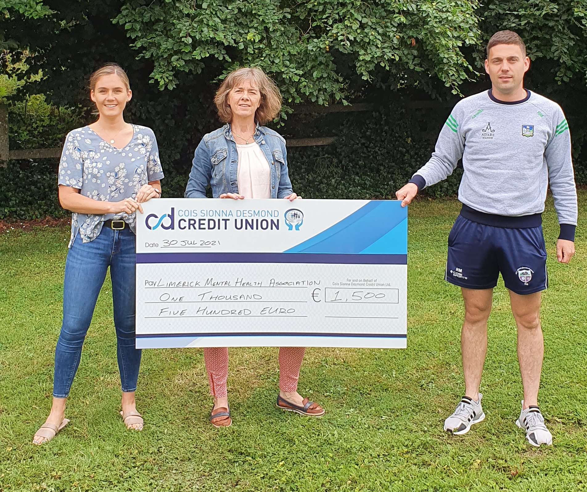 Curraghchase 10k presenting LMHA with a cheque for €1500 raised from the event